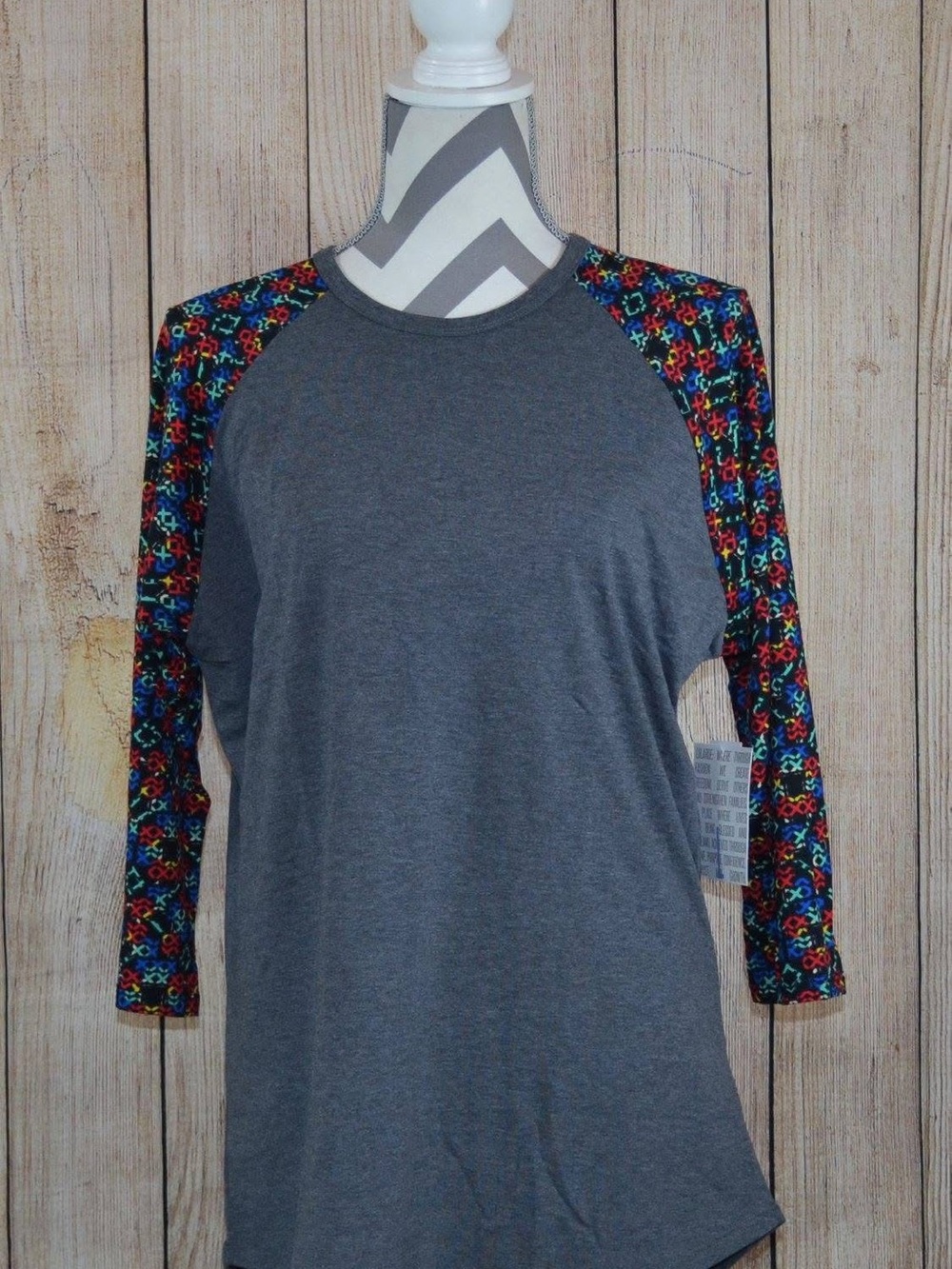 LuLaRoe Randy Gray Raglan Top with Multicolor Geometric Sleeves